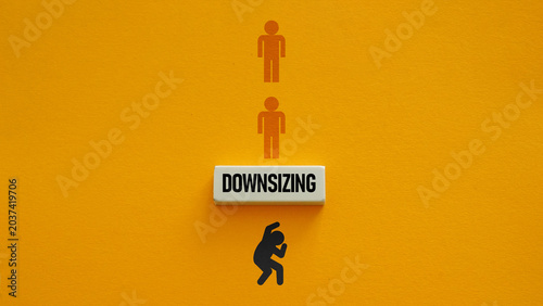Bild auf Leinwand Downsizing, Workforce Reduction, Layoffs and Economic Pressure Concept Represent