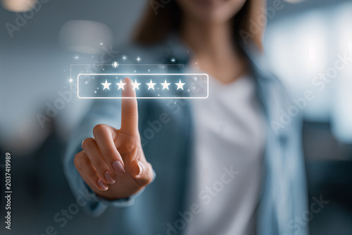 Customer Support Concept - Woman Giving Five-Star Rating with Touch Screen Technology to Enhance