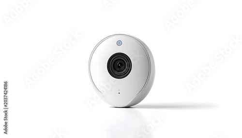 Isolated modern white security camera with wide lens and blue indicator light, home surveillance technology