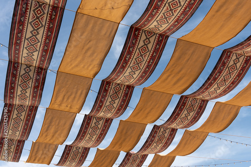 Foto Authentic Arabic Patterned Fabric Canopy Perspective at Mina District, Old Doha Port Heritage, Qatar