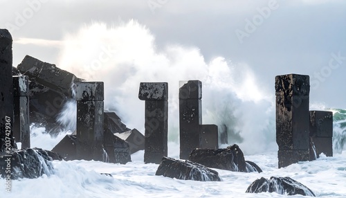 A rocky shoreline with large waves crashing against the shore