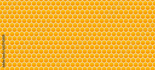 Honeycomb seamless repeatable pattern background in golden honey yellow color