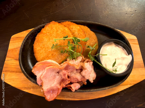 Draniki with bacon are a traditional Belarusian dish.