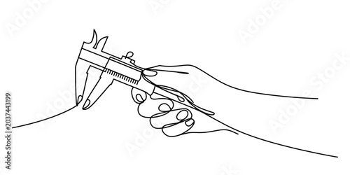 Photos Hand holding a metal caliper measuring a thin object