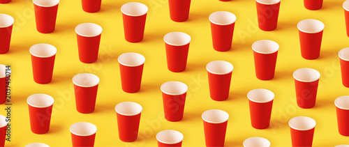 Seamless pattern of upright red cups on a vibrant yellow background, creating a bold geometric design perfect for modern advertising and creative projects.