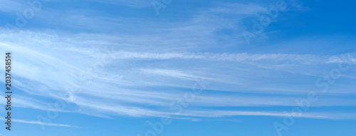Canvas Print Panoramic light blue sky with thin white cirrus clouds texture background on bea