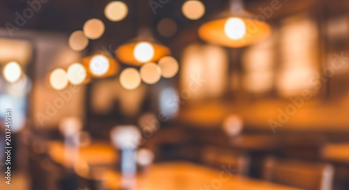 Vászonkép Blurred abstract background warm light cozy cafe interior glowing bokeh circles