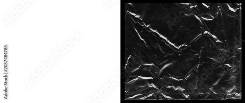 Foto Crumpled plastic wrap texture on black background, wrinkled transparent cellopha