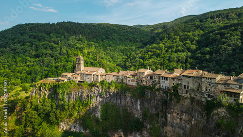 Fotografie Aerial drone panorama of Castellfollit de la Roca village built on volcanic basa