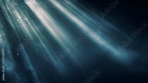 Abstract light rays background soft blue mist glowing particles dark space atmospheric scene