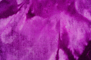 Purple tie dye fabric texture at macro level