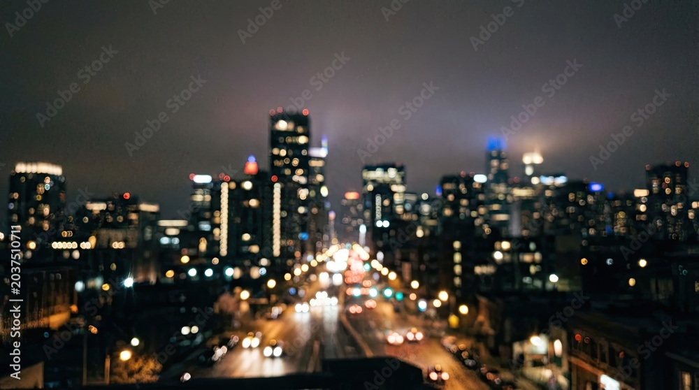 Fototapeta premium Sad lofi boy sitting by window on rainy night concept. Blurred city skyline at night with glowing lights and busy streets.
