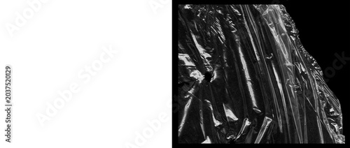 Photos Crumpled black plastic texture with glossy highlights, wrinkled dark synthetic m