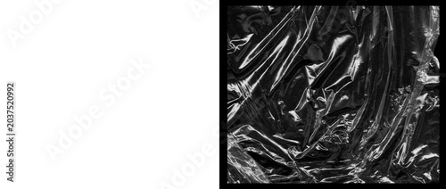 Foto Crumpled black plastic texture, glossy wrinkled cellophane wrap background, shin