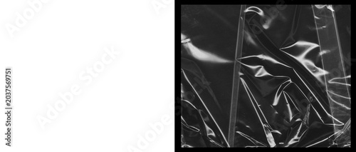 Foto Crumpled plastic wrap texture on black background, wrinkled cellophane film over