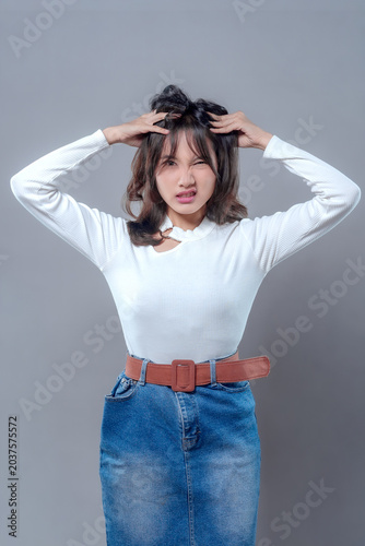Bild auf Leinwand Frustrated Asian Woman Holding Head in Stress