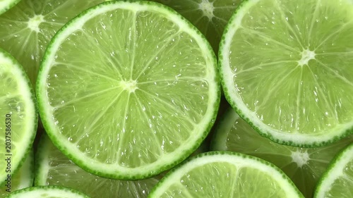 Close-up of numerous lime slices overlapping each other