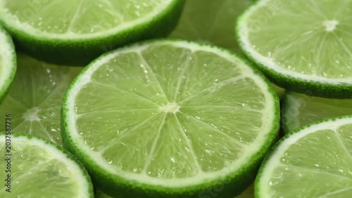 Close-up of numerous lime slices overlapping each other