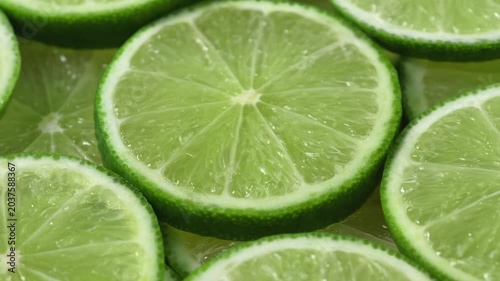 Close-up of numerous lime slices overlapping each other