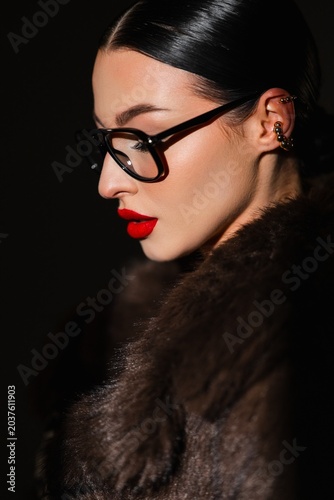 Fashionable Woman In Evening Attire. Sophisticated Woman With Bold Red Lipstick And Fur Coat