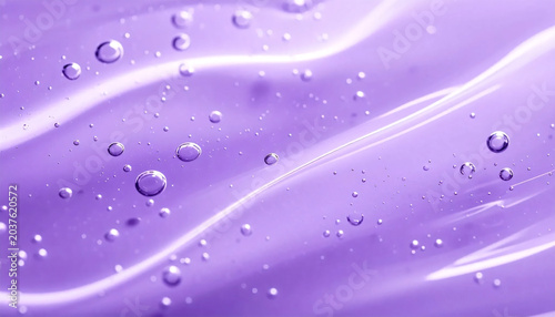 Close up of transparent purple cosmetic gel serum background