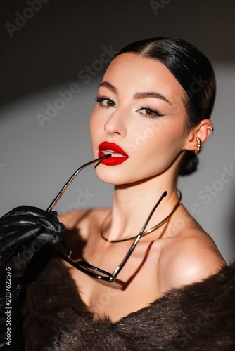 Striking Studio Shot Of Confident Woman. Beautiful Asian Woman Showcasing Elegance And Style In Studio