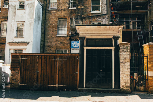 Принти на полотні Echoes of the Past: The Weathered Grandeur of an Old Historic Door