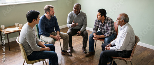 Men's support group sharing emotional struggles in a community setting