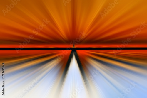 Abstract radial zoom blur with orange, red, white and blue light streaks on a dark background, radiating from a triangular center and creating a dynamic contrast of warm and cool tones.