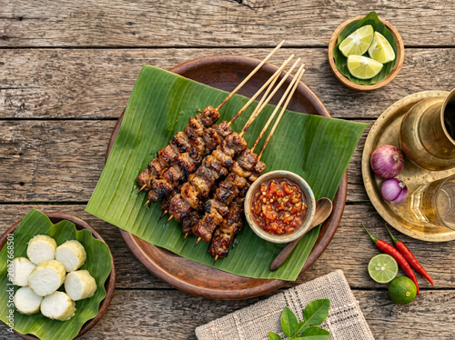 Indonesian Grilled Meat Satay with Rice Cakes and Spicy Sambal
