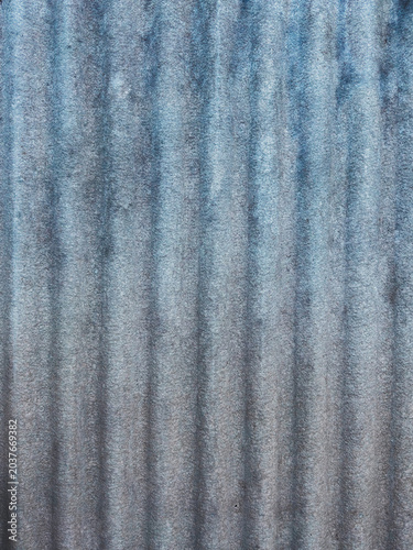 Rippled weathered corrugated iron texture with blue gray gradient for industrial background