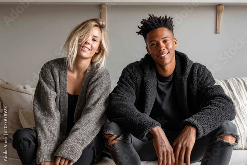 Portrait of a content couple in their 20s wearing a chic cardigan on crisp minimalistic living room
