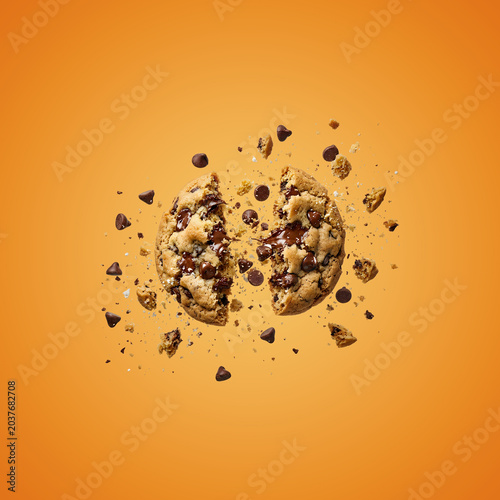 Broken Chocolate Chip Cookie on Orange Background