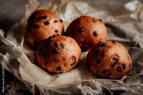 Homemade sweet buns studded with rich chocolate chips.