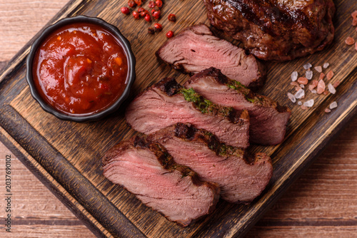 Beef mignon steak, rare, meat grilled with salt and spices. Beef steak