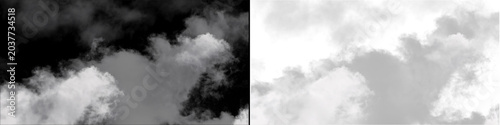 Bild auf Leinwand Wispy white clouds floating on dark background with soft edges and diffused light for abstract backgrounds