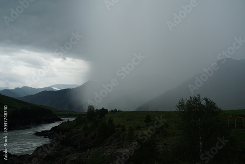 Photos Dark, gloomy clouds loomed, foreshadowing an approaching storm.