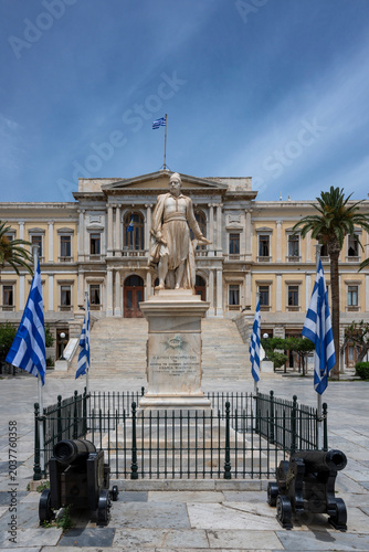 Stautues and grand building in Ermoupoli main square on Syros
