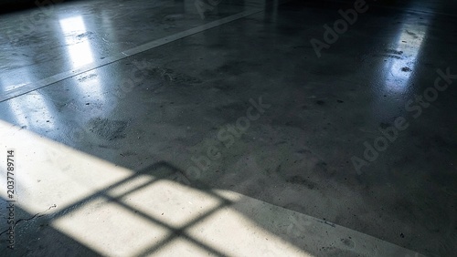Concrete floor with dramatic geometric shadows