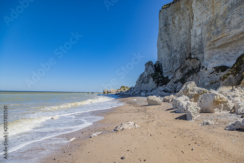 Towering White Chalk Cliffs and Rugged Pebble Beach on the Alabaster Coast in Normandy