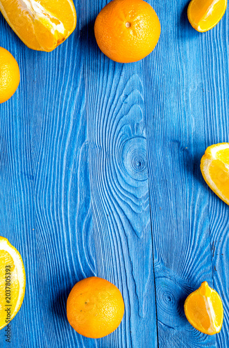 sliced oranges for lunch on blue background top view mockup