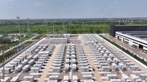 Aerial view of large energy storage power station with white container equipment