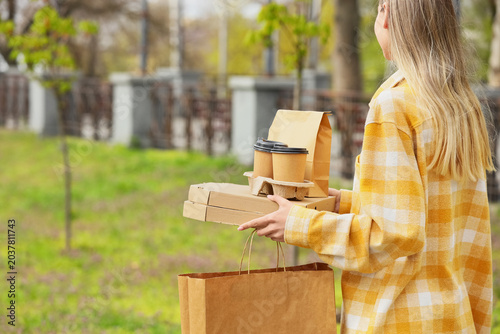 Young woman with paper bags...