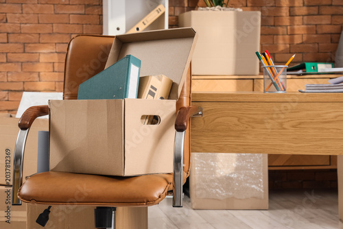 Chair with cardboard box in...