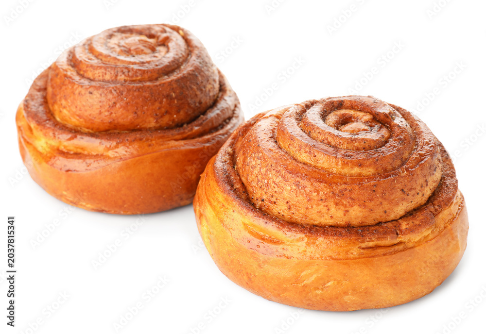 Fototapeta premium Two tasty cinnamon rolls isolated on white
