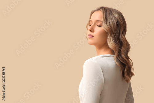 Blonde young woman with cur...
