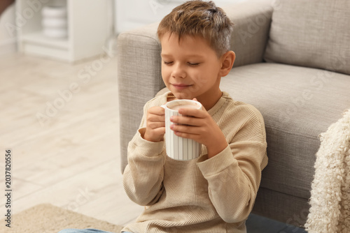 Cute little boy with cup of...