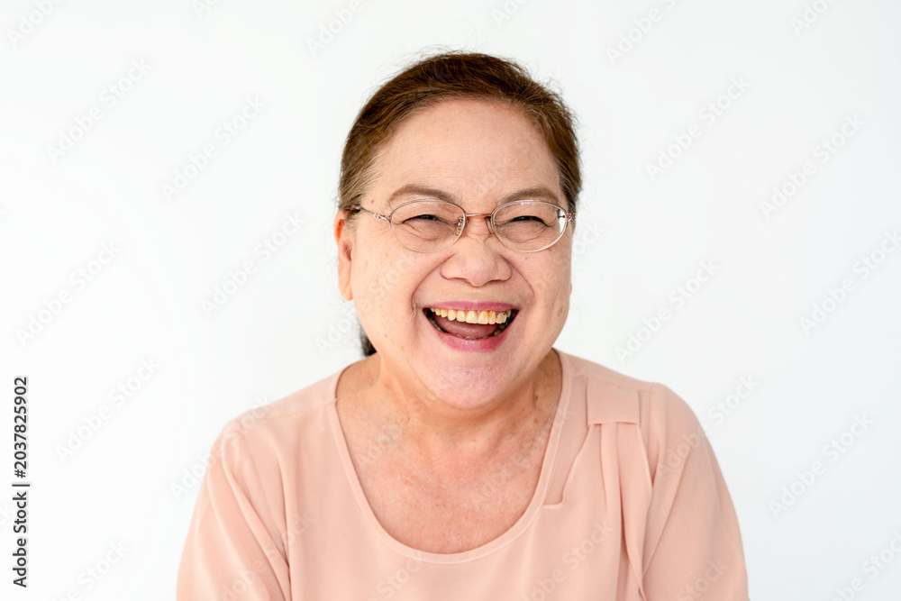Fototapeta premium Joyful elderly woman smiling brightly.