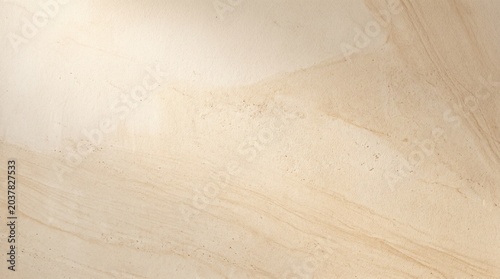 Natural sandstone texture background with soft beige and cream color tones and subtle layered geological patterns