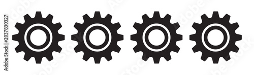 Bild auf Leinwand Four black gear icons identical design with central hole symbolizing industrial machinery and technological components
